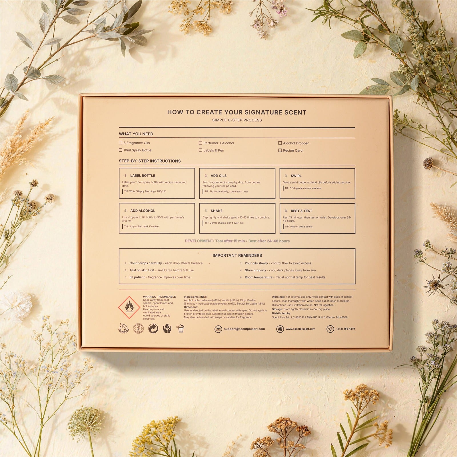 SCENT PLUS ART instruction card displaying 6-step perfume creation process with supply checklist and safety guidelines, surrounded by dried floral arrangement on textured cream background